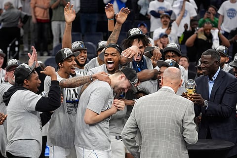 Dallas Mavericks guard Luka Doncic, center, celebrates with teammates after Game 5 of the Western Conference finals in the NBA basketball playoffs against the Minnesota Timberwolves, Thursday, May 30, 2024, in Minneapolis. The Mavericks won 124-103, taking the series 4-1 and moving on to the NBA Finals. 


